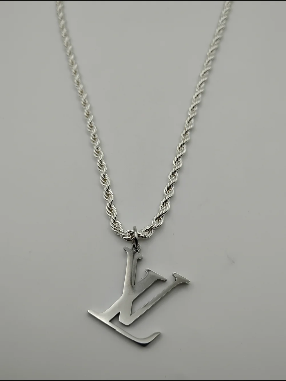 Louis Vuitton Silver LV Logo Pendant On A Sterling Silver Rope Necklace
